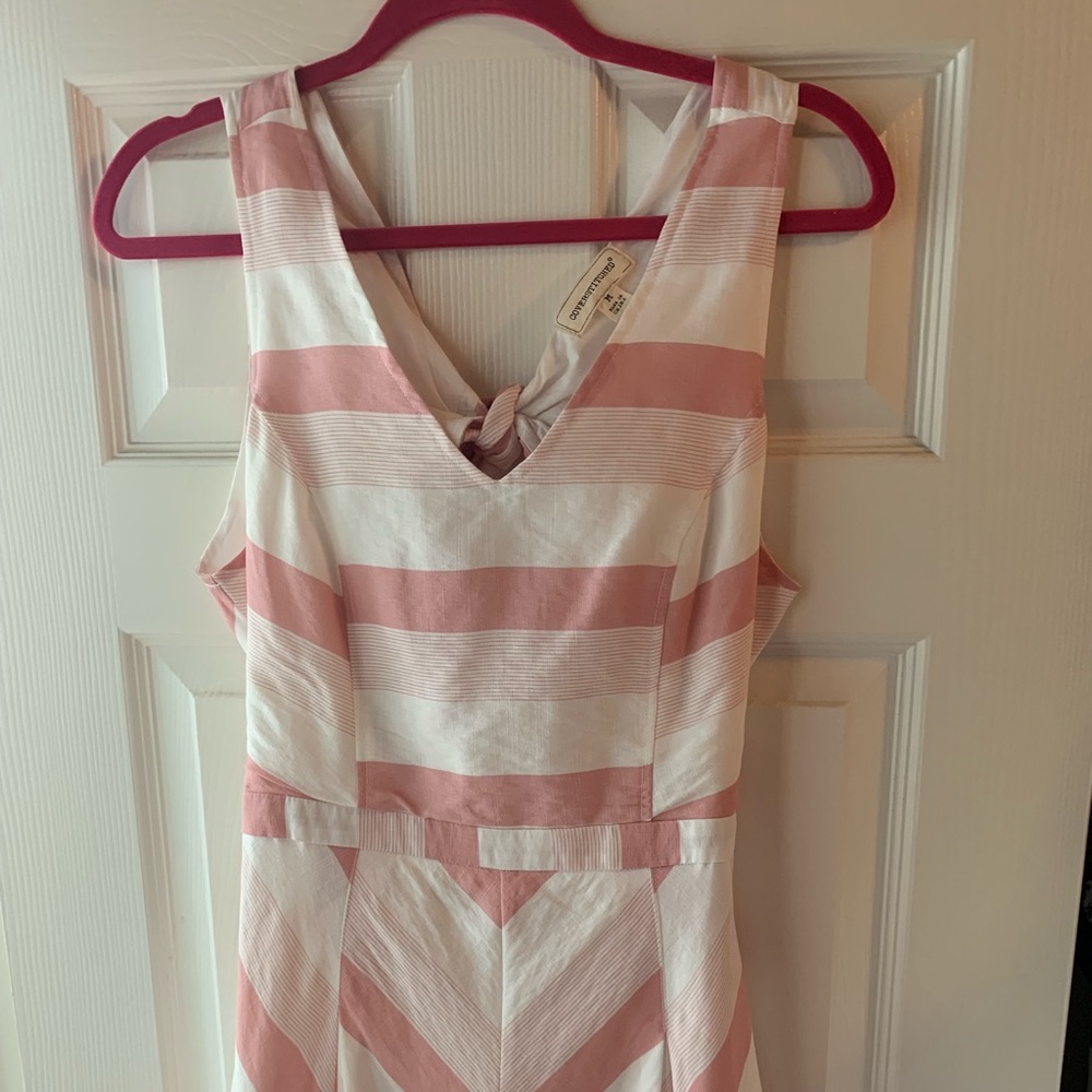 Woman’s pink and white striped romper